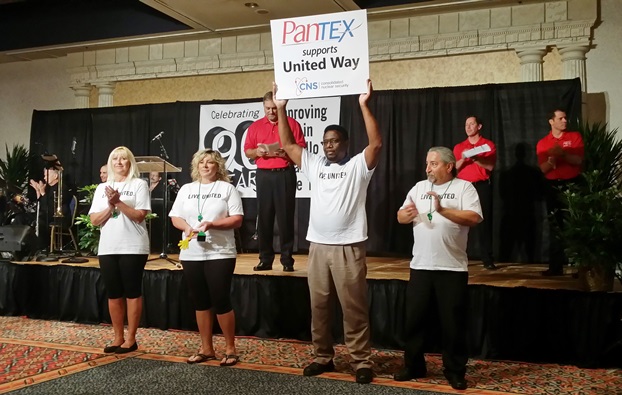 Clarence Rashada holds up a sign expressing Pantexan support during the United Way