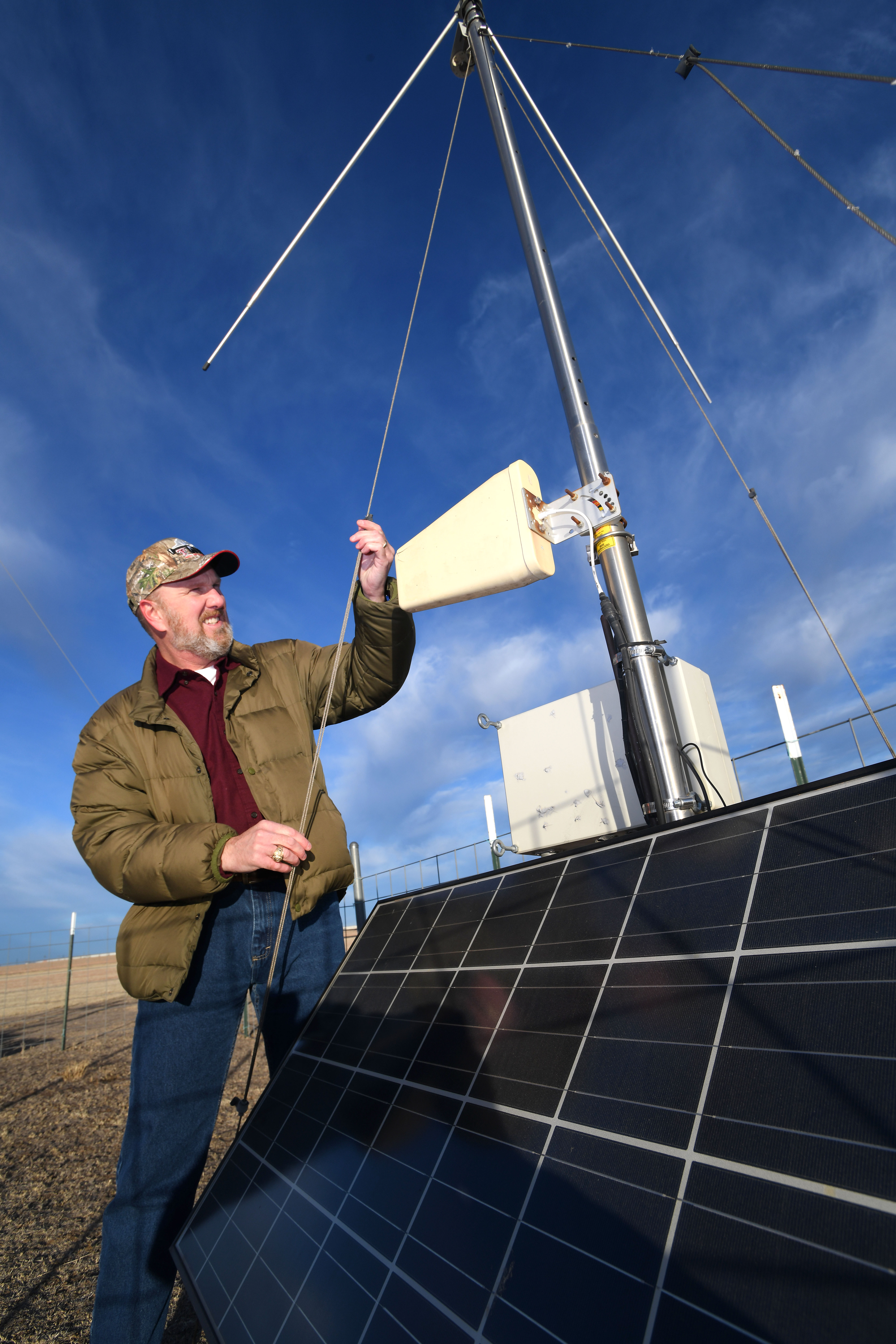 Pantex Staff Meteorologist Steve Kersh checks out a MesoNet weather gathering site.