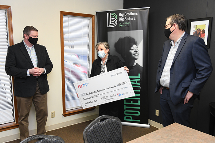 CNS Chief Operating Officer Bill Tindal (left) and Pantex Site Manager Todd Ailes give a $10,000 donation to Emily Nance, Big Brothers Big Sisters of the Texas Panhandle.