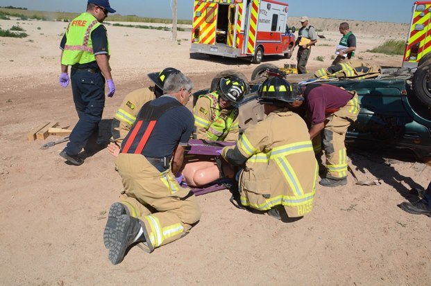 Pantex Fire Department emergency response personnel work to extract a training mannequin 