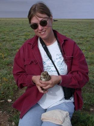 Erica Chipman, holds a Western Burrowing Owl
