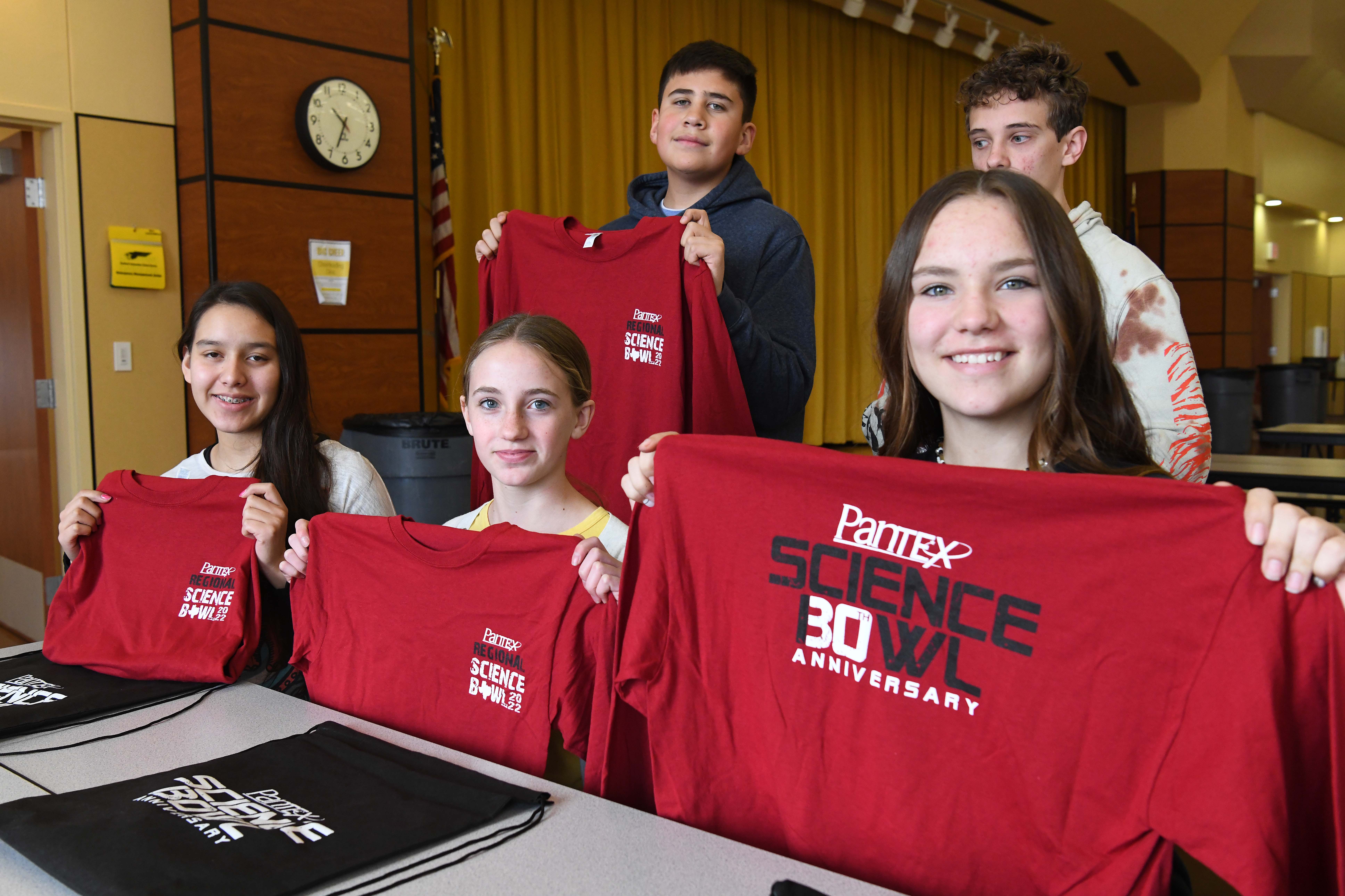 Bushland Middle School shows off their Pantex Science Bowl 30th anniversary shirts and bags