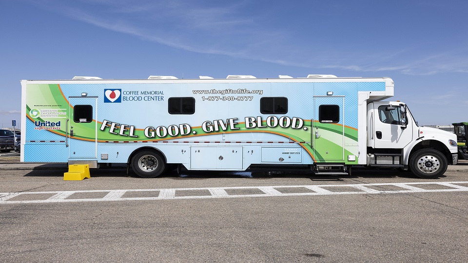 The Coffee Memorial Blood Center mobile donation bus parked at the JCDC. Photo by Adam Baker.