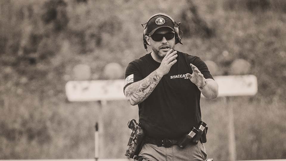 Jordan Gladman leads firearms training during a live-range exercise.