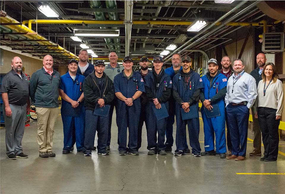 Members of Quality stand with the W88 team 