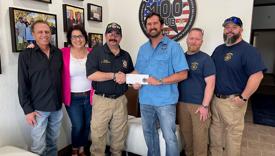The 100 Club of the Texas Panhandle presents a check to the Palisades Fire Department
