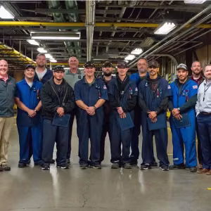 Members of Quality stand with the W88 team