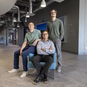 From left: Landon, Kyle and Connor Bräck pose for a family photo